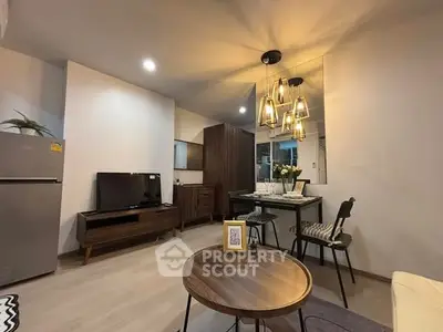 Modern living room with stylish decor and dining area, perfect for urban living.
