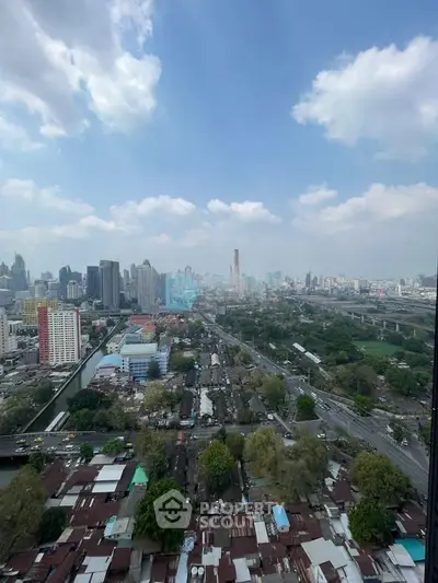 Stunning cityscape view from a high-rise building, showcasing urban skyline and vibrant city life.
