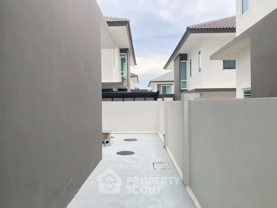 Modern residential exterior with clean lines and minimalist design, showcasing contemporary architecture.