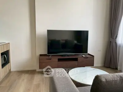 Modern living room with sleek TV stand and cozy seating area
