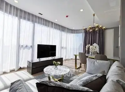 Luxurious modern living room with elegant decor and abundant natural light