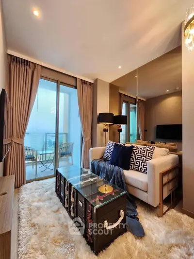 Luxurious living room with plush rug, modern sofa, and balcony view