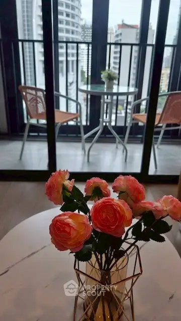 Chic balcony view with cityscape backdrop and elegant floral decor