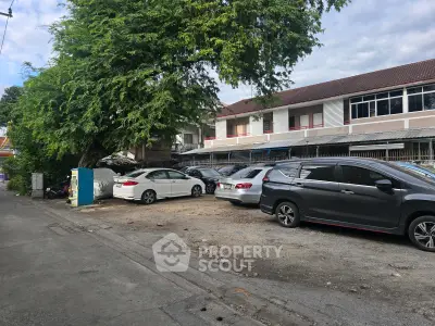 Charming suburban property with ample parking and lush greenery, perfect for residential or commercial use.