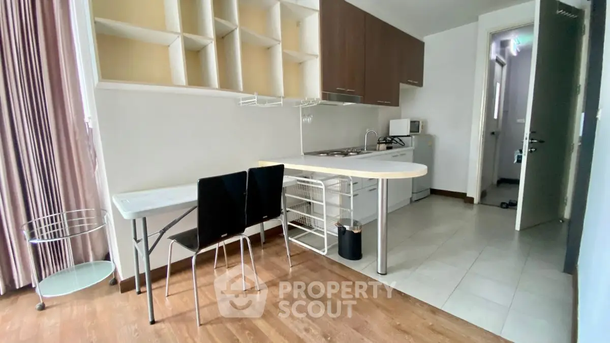 Modern kitchen with open layout and dining area in stylish apartment