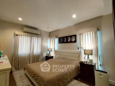 Cozy bedroom with elegant decor and soft lighting, perfect for relaxation.