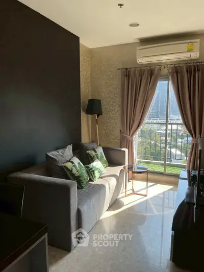 Cozy living room with city view, modern sofa, and natural light.