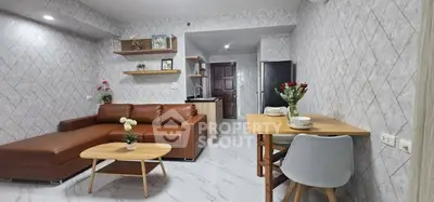 Modern living room with stylish decor and open kitchen layout