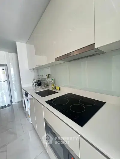 Modern kitchen with sleek design and electric cooktop