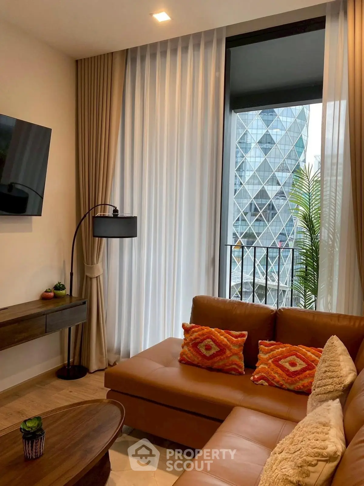 Stylish living room with modern decor and city view from window