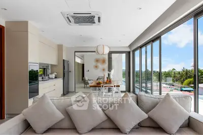 Luxurious open-plan living room with modern kitchen and stunning panoramic views.