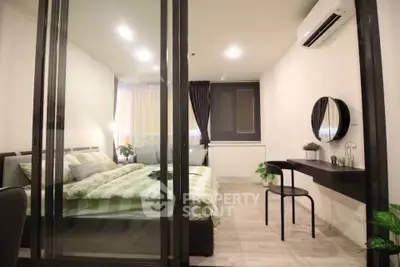 Modern bedroom with glass partition, stylish decor, and air conditioning unit.