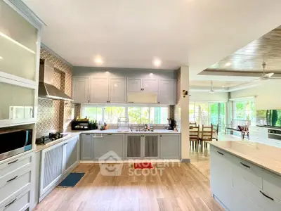 Spacious modern kitchen with open layout and elegant cabinetry