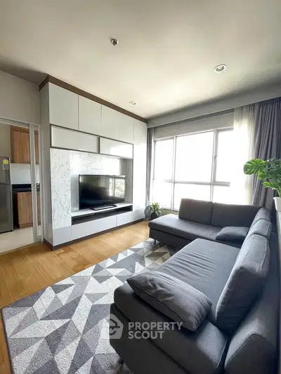 Modern living room with large windows and stylish furniture