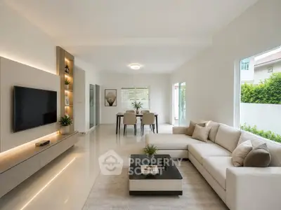 Spacious modern living room with elegant decor and large windows for natural light.