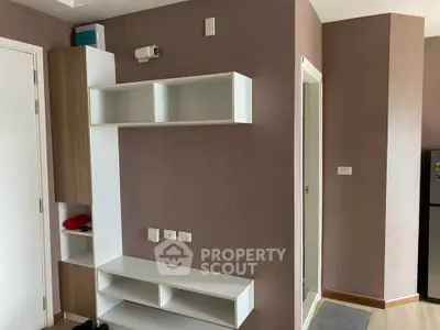 Modern interior with sleek white shelving and neutral walls