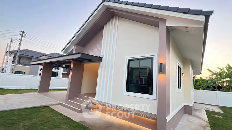 Modern single-story house with sleek design and spacious driveway