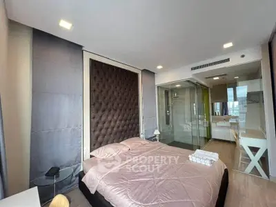 Modern bedroom with ensuite bathroom and stylish decor in luxury apartment