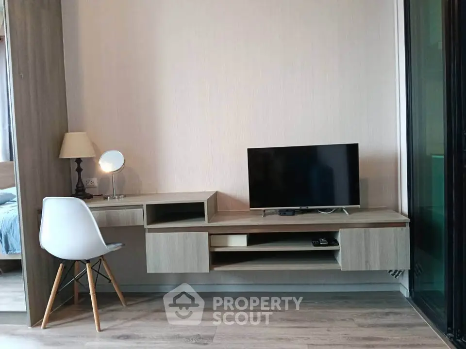 Modern living room with sleek TV stand and stylish chair