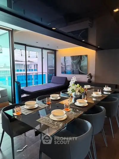 Luxurious dining area with elegant table setting and spacious balcony view