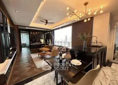 Luxurious open-layout living room with modern kitchen and stunning city view