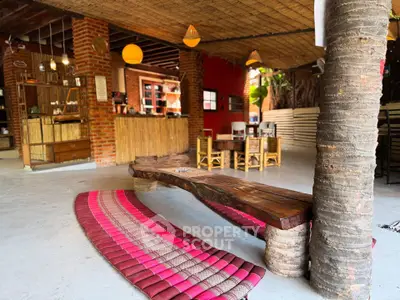 Charming rustic living area with wooden furniture and vibrant decor, perfect for relaxation and gatherings.