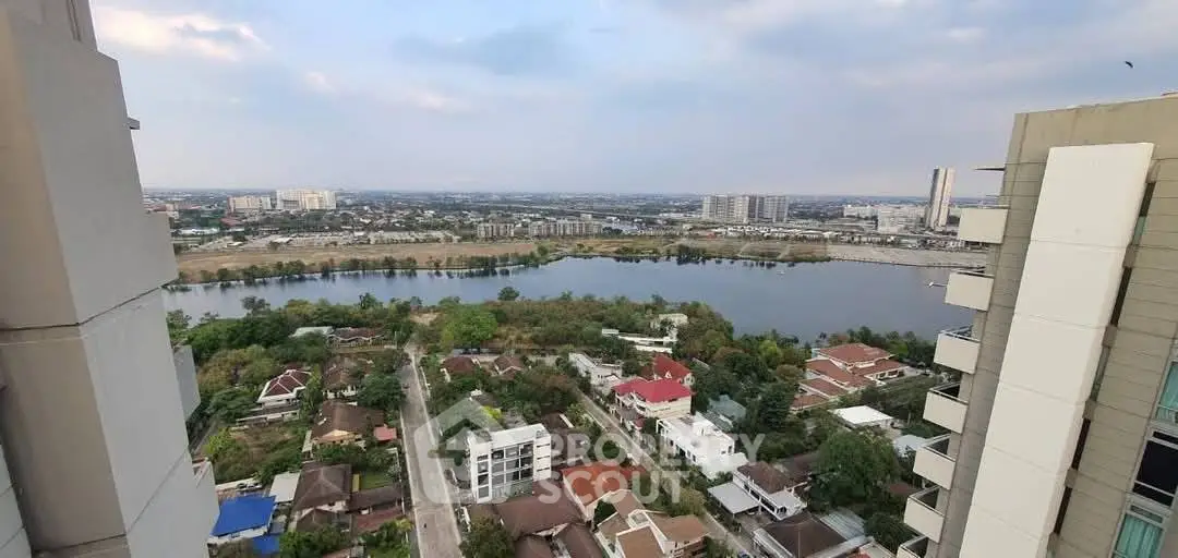Stunning high-rise view of cityscape and river, perfect for urban living.