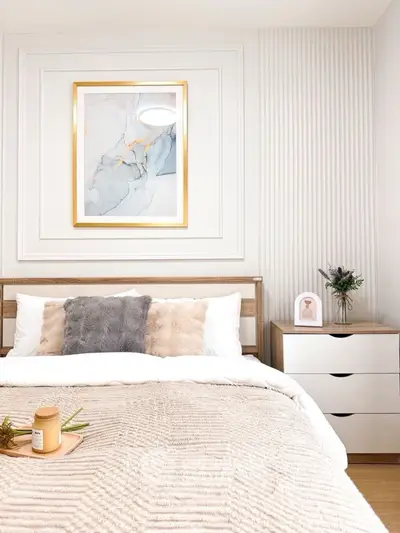 Elegant bedroom with modern decor and cozy bedding