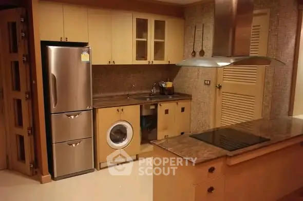 Modern kitchen with stainless steel appliances and sleek cabinetry
