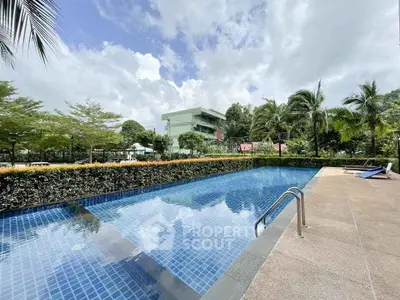 Stunning outdoor pool with lush greenery and modern architecture