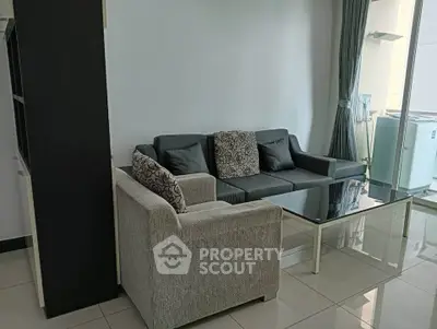 Modern living room with stylish furniture and natural light, perfect for relaxation and entertaining.