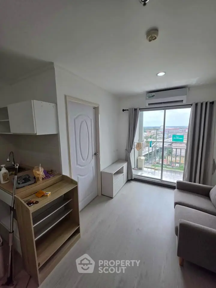 Modern living room with balcony view in a cozy apartment
