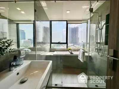 Luxurious bathroom with city view, featuring modern fixtures and elegant design.