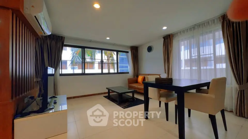Spacious modern living room with large windows and stylish furniture