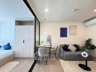 Modern apartment interior with cozy living room and dining area, featuring stylish decor and natural light.