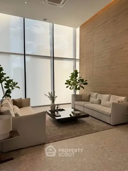 Elegant modern living room with high ceilings and large windows