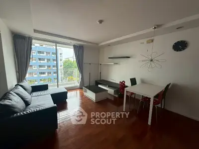 Modern living room with sleek furniture and large windows offering a bright and airy atmosphere.