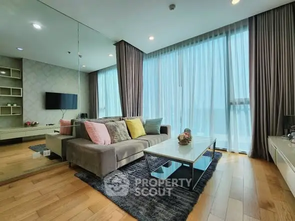 Luxurious living room with floor-to-ceiling windows and modern decor