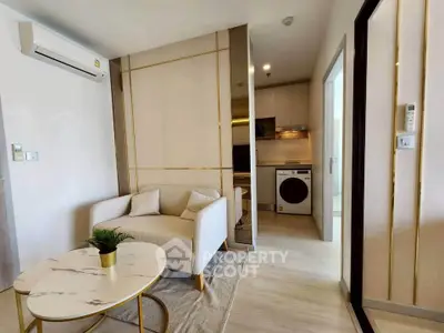 Modern living room with cozy sofa and stylish kitchen area