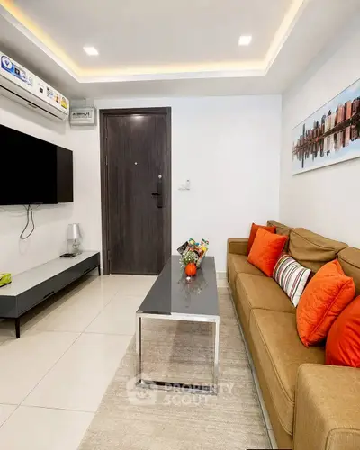 Modern living room with stylish decor and comfortable seating in a contemporary apartment.