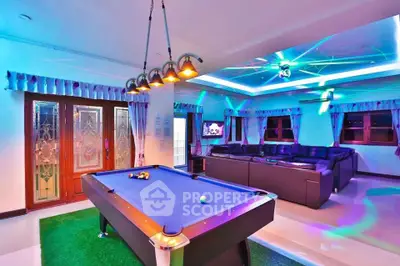 Luxurious entertainment room with pool table and modern lighting