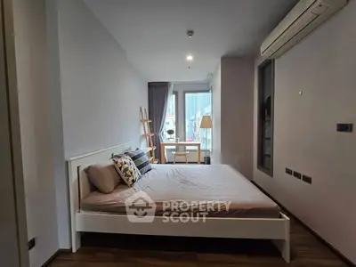 Modern bedroom with stylish decor and natural light