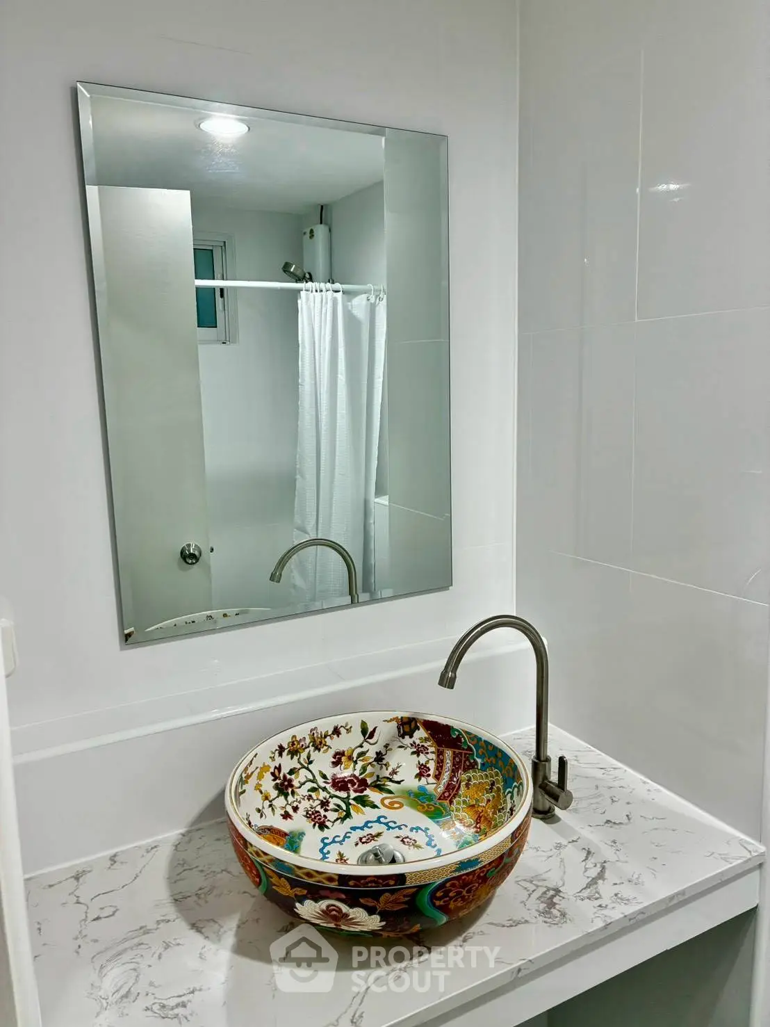 Stylish bathroom with colorful ceramic sink and modern fixtures