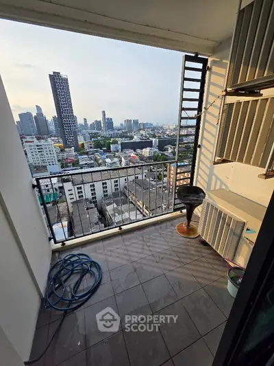 High-rise balcony with stunning cityscape view, perfect for urban living enthusiasts.