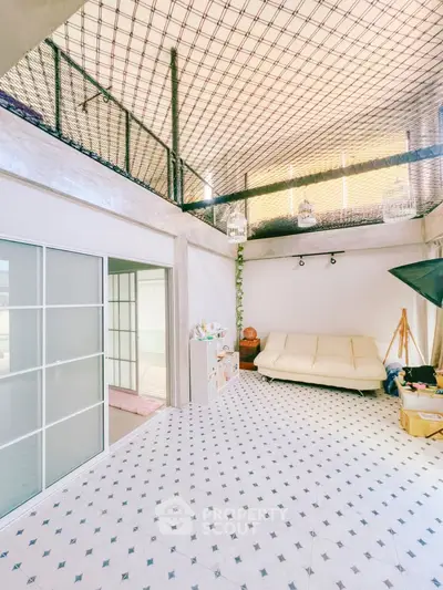 Spacious modern living room with high ceiling and stylish decor