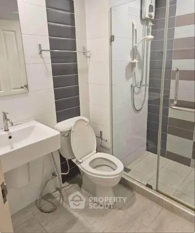 Modern bathroom with glass shower and sleek fixtures