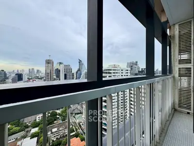 Stunning cityscape view from a high-rise balcony with modern railing design.