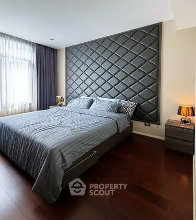 Luxurious bedroom with elegant quilted accent wall and modern decor