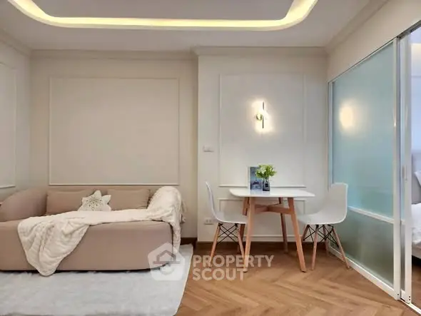 Chic modern living room with cozy sofa and stylish dining area, perfect for urban living.