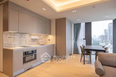 Modern open-layout kitchen and dining area with city view in luxury apartment